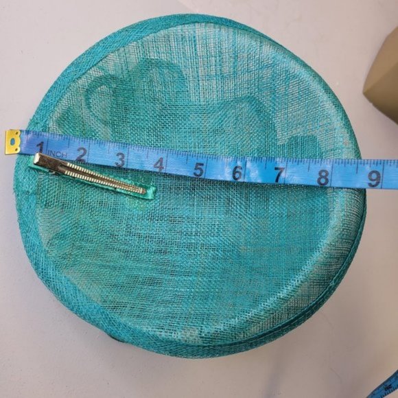 Blue Fascinator with an Upturned Brim Sinamay Loops Rosettes and Feathers - Picture 7 of 16